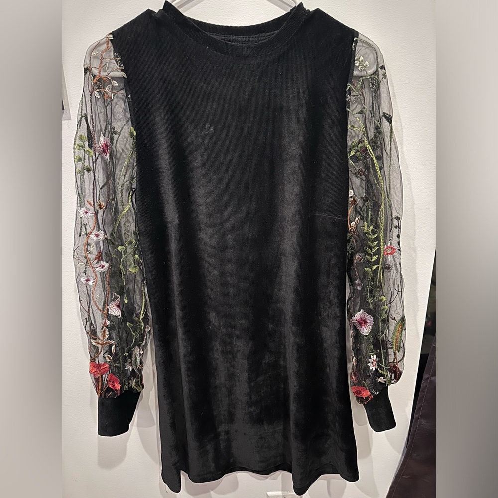 Long sleeve dress with beautiful embroidery.